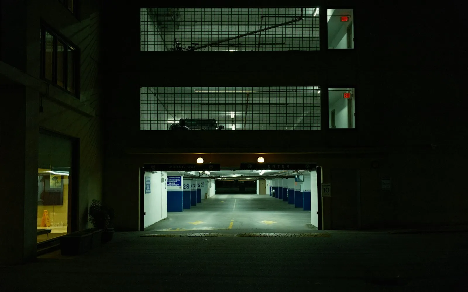 Empty parking structure under lights at night